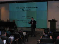 James Hilton James Hilton stands in front of an audience for his presentation "The Digital Preservation Network".