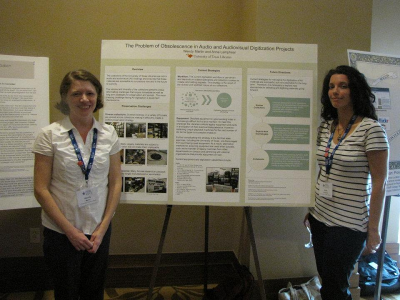 Wendy Martin and Anna Lamphear stand in front of their poster.