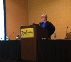 Nancy McGovern at TCDL 2013 Nancy McGovern stands in front of a podium.