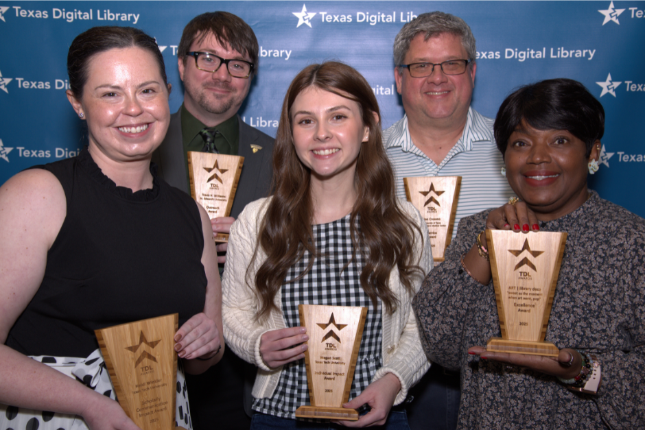 Photo of 2025 TDL Awards Recipients against the Texas Digital Library backdrop.